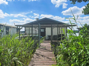 Chalet Bootshaus auf dem See by Interhome